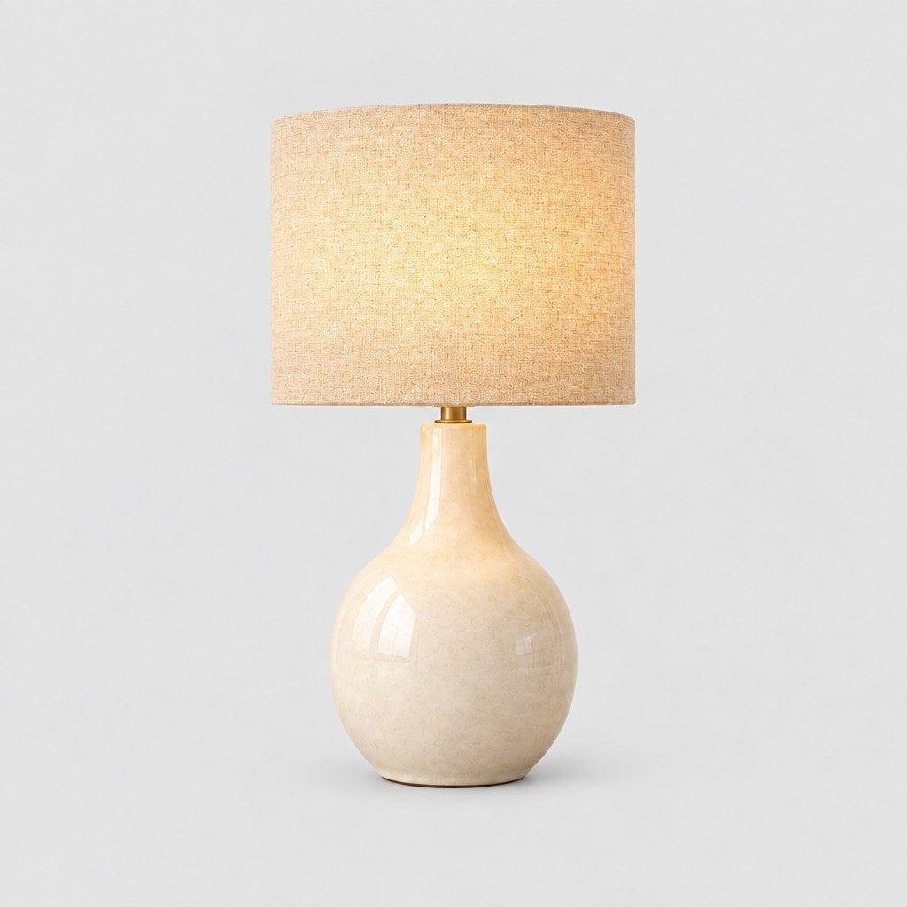 Mara ceramic table lamp switched on, three quarter view