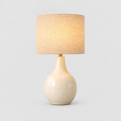 Mara ceramic table lamp switched on, three quarter view